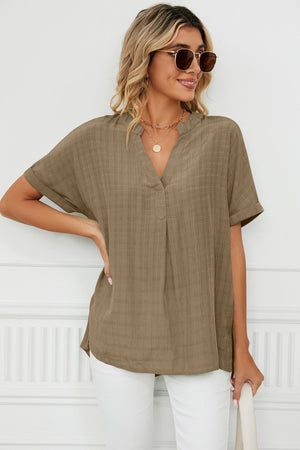 Camel linen blend blouse with V-neck and short sleeves, subtle plaid texture.