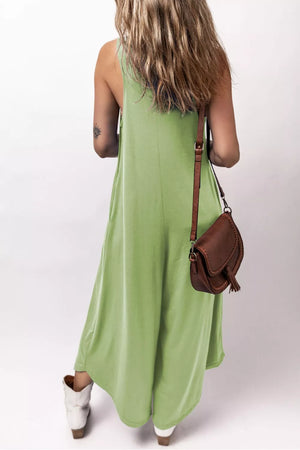 Sleeveless wide-leg lime green casual romper with side pockets.