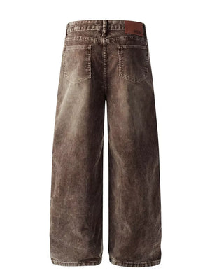 Brown corduroy wide-leg pants with back pockets and a leather logo patch.