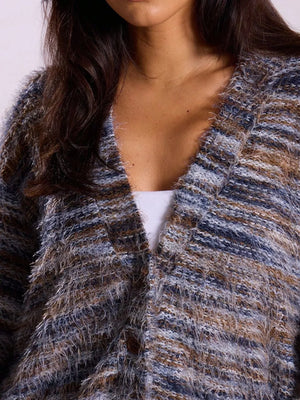 Cozy textured knit cardigan in blue and brown marled yarn with fuzzy fringe detail and button front.