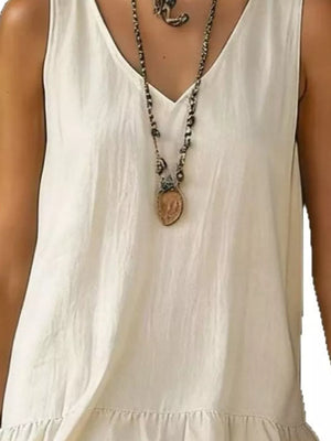 White tiered ruffled hem v-neck dress with a layered necklace