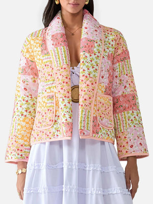 Floral quilted patchwork jacket in pink and orange with a shawl collar and patch pockets.