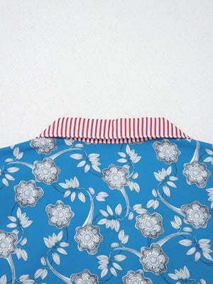 Blue cotton blouse with floral print and red striped collar detail.