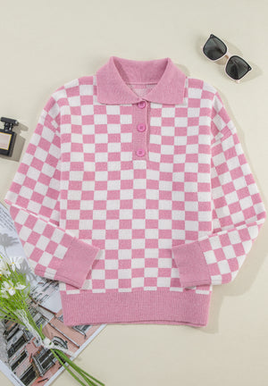 Pink checkerboard knit polo sweater with button detail and ribbed cuffs and hem