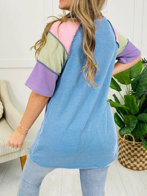 Color block patchwork henley t-shirt with waffle knit texture and striped blue body.