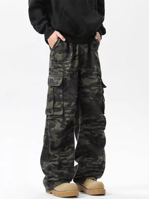 Relaxed fit dark camo cargo pants with multiple pockets.