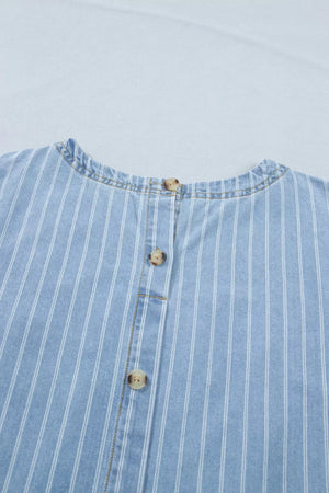 Denim mini dress with vertical white pinstripes and button front detail.