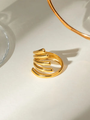 Gold-plated ribbed ring with a sculptural spiral design
