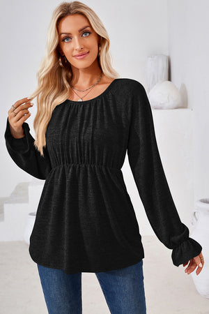 Black peasant blouse with gathered neckline, elastic waist, and ruffled cuffs.