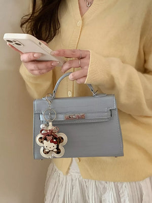 Croc-embossed Top-handle Crossbody Bag in Blue, model styling view