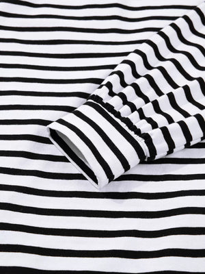 Black and white striped collared long sleeve dress with button detail on cuff.