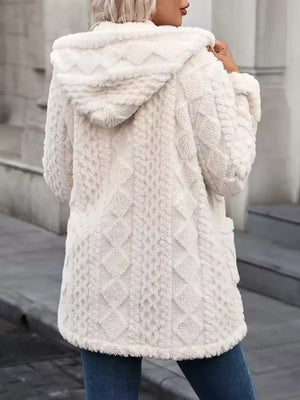 Plush hooded fleece trench coat in cream with diamond knit texture and a cozy feel.