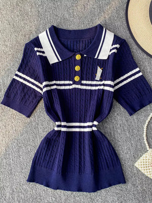 Blue cable knit polo shirt with white stripes and gold buttons.
