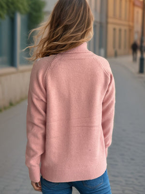 Relaxed raglan turtleneck knit sweater in blush pink with ribbed cuffs and hem.