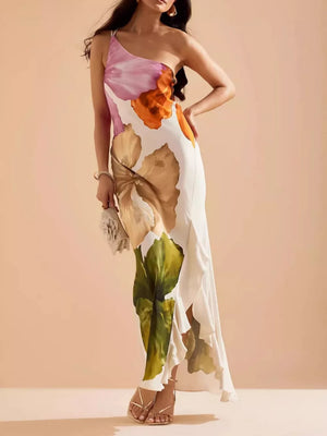 Floral one-shoulder maxi dress with cascading ruffle and large bloom print.