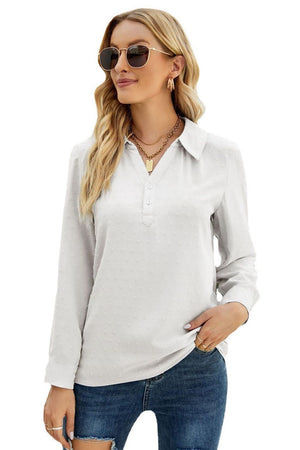 White textured collared blouse with button placket and long sleeves.
