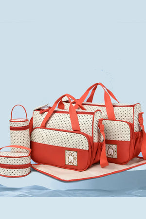 Red and cream polka dot diaper bag set with matching accessories and embroidered animal detail.
