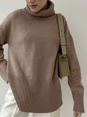 Mocha ribbed turtleneck sweater with flared sleeves and a textured hem.
