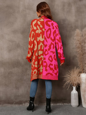 Colorblock leopard knit duster cardigan in red and pink with tan accents.