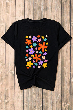 Black round neck tee with a colorful bloom print and twisted hem.
