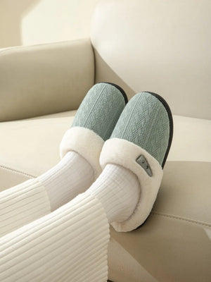 Dusty Blue cable knit shearling house slippers with white trim and button detail.