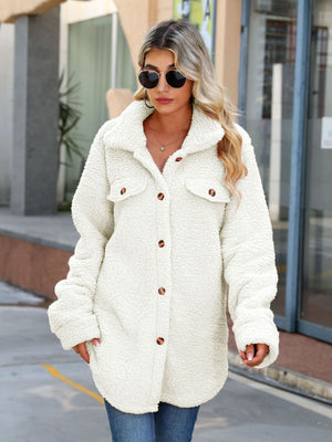 White teddy-texture shacket with button-down front and chest pockets.