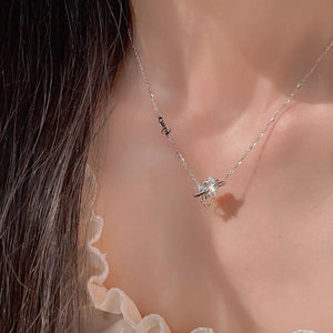 Elegant silver necklace with a sparkling zircon heart pendant and delicate chain.