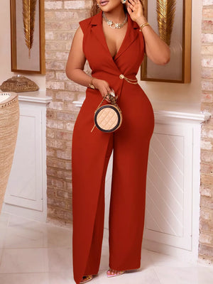 Brown asymmetrical blazer jumpsuit with chain detail and wide legs.