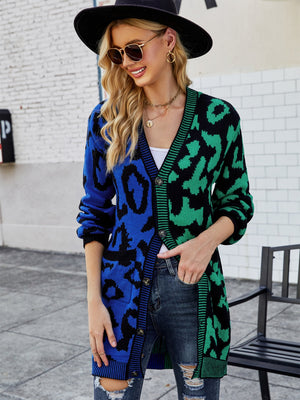 Colorblock leopard knit duster cardigan with button front and pockets.