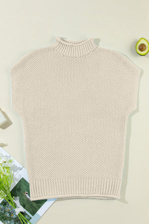 Boxy knit turtleneck shell sweater in beige with cap sleeves and ribbed trim.