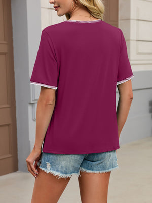 Purple t-shirt with short sleeves and contrast trim neckline and cuffs.