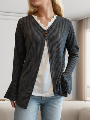 Dark gray ribbed knit layered top with bell sleeves and decorative button, styled with white lace trim.