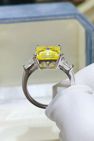 Canary yellow emerald cut ring with side stones on a silver band