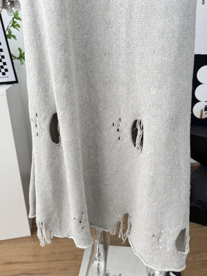 Light gray distressed cotton sweater set with deconstructed details and frayed hem.