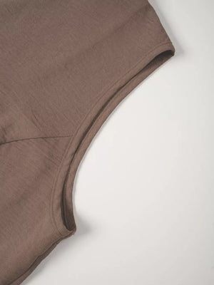 Taupe cropped vest detail showing textured fabric and clean seam finishing.