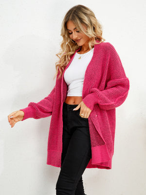 Hot Pink textured cocoon cardigan with balloon sleeves and open front.