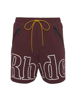 Burgundy cargo shorts with white "Rhude" logo and yellow drawstring.