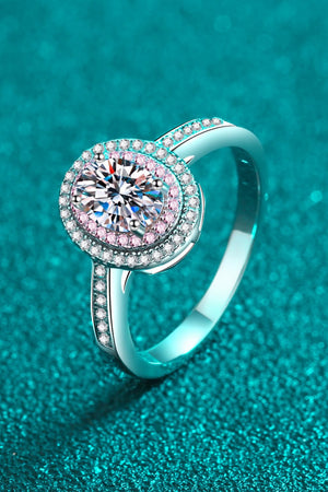 Silver ring with oval halo and pink stone accents