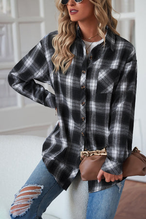 Black plaid drop-shoulder jacket with button front and chest pocket.