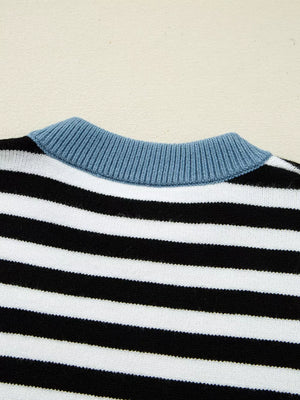 Colorblock striped knit sweater with crew neck and blue ribbed collar detail.