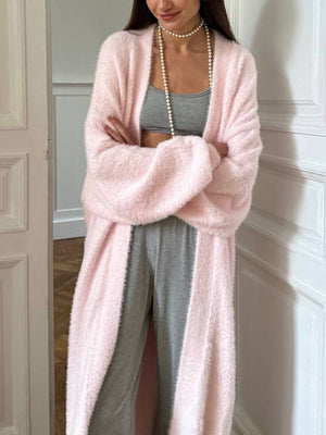 Plush pink maxi cardigan with balloon sleeves worn open over gray loungewear.