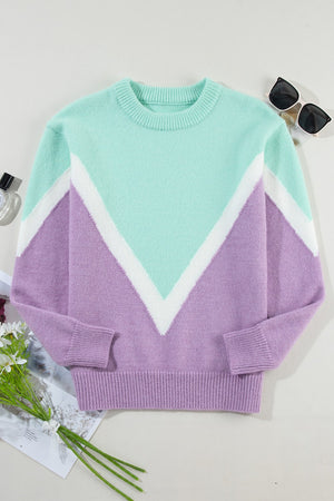 Chevron colorblock knit pullover sweater in lavender and mint green with white accents.