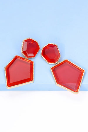 Red resin facet drop earrings with gold trim, geometric shapes.