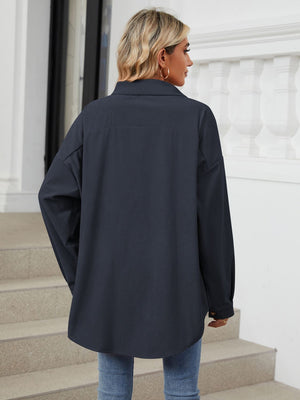 Oversized corduroy shirt jacket in Dark Navy with buttoned cuffs and a relaxed fit.