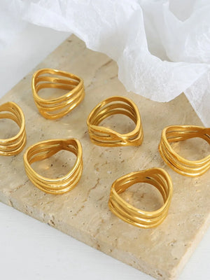 Gold triple-band sculptural ring with wavy design, 18K gold-plated