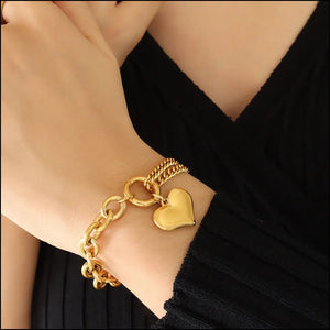 Gold heart charm bracelet with chunky chain detail