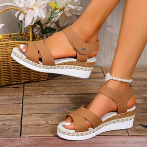 Espadrille platform cross-strap sandals in black with jute sole.