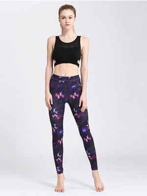 Purple cosmic print contour leggings with piping and a high waist.