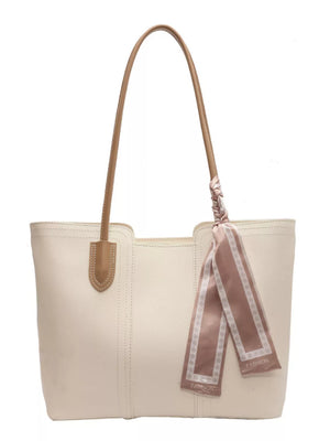 Elegant white pu leather tote bag with tan straps and decorative scarf detail.