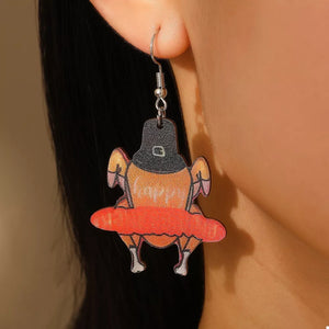 Thanksgiving turkey charm dangle earrings in acrylic with orange and black details.